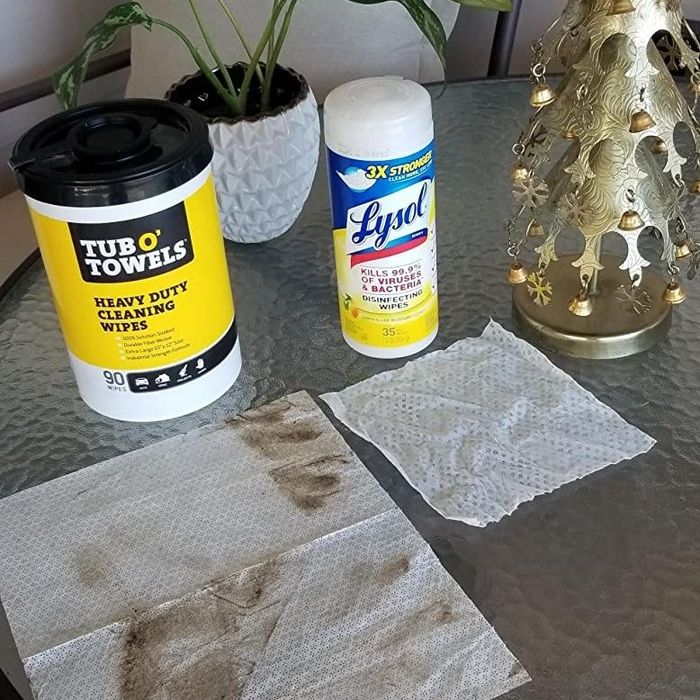 A Tub O' Towels next to a small tub of Lysol wipes, highlighting the larger size and superior cleaning power of the Tub O' Towels.