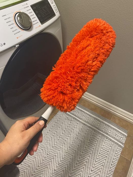 A red handheld duster.