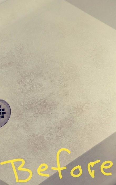 Amazon reviewer photo of a grimy shower