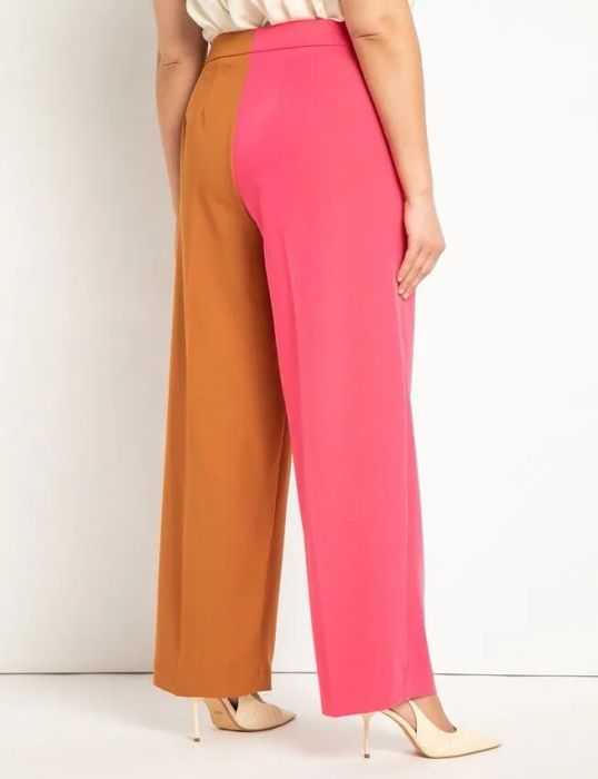 The back view of a model wearing the same pants, with one leg in pink and the other in brown, adding a vibrant twist to the design.