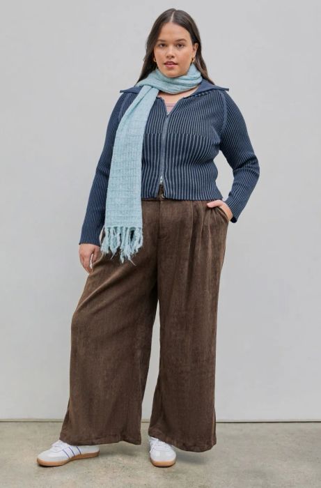 a model showcasing the identical pants in a brown shade