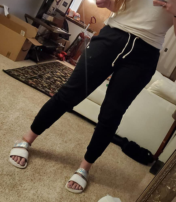 Reviewer wearing black pants, shown in the image