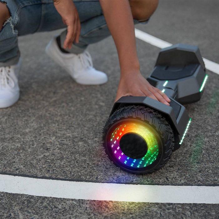 Hands placed on a glowing hoverboard.