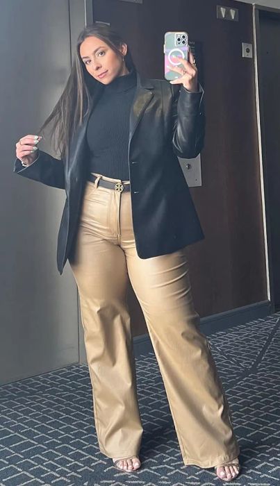 a reviewer modeling the pants in tan