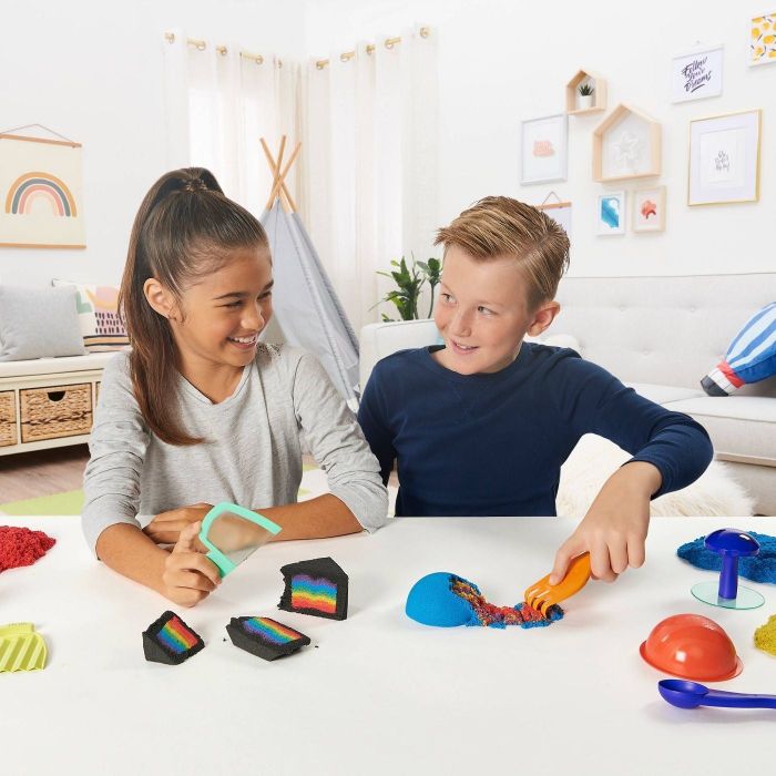Children playing with Kinetic Sand