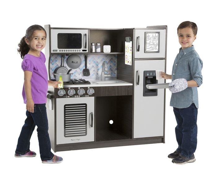 A gray and black kitchenette complete with kitchen accessories