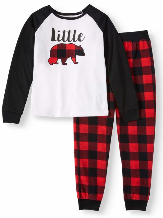 A black and white pajama top paired with red and black buffalo plaid pants.