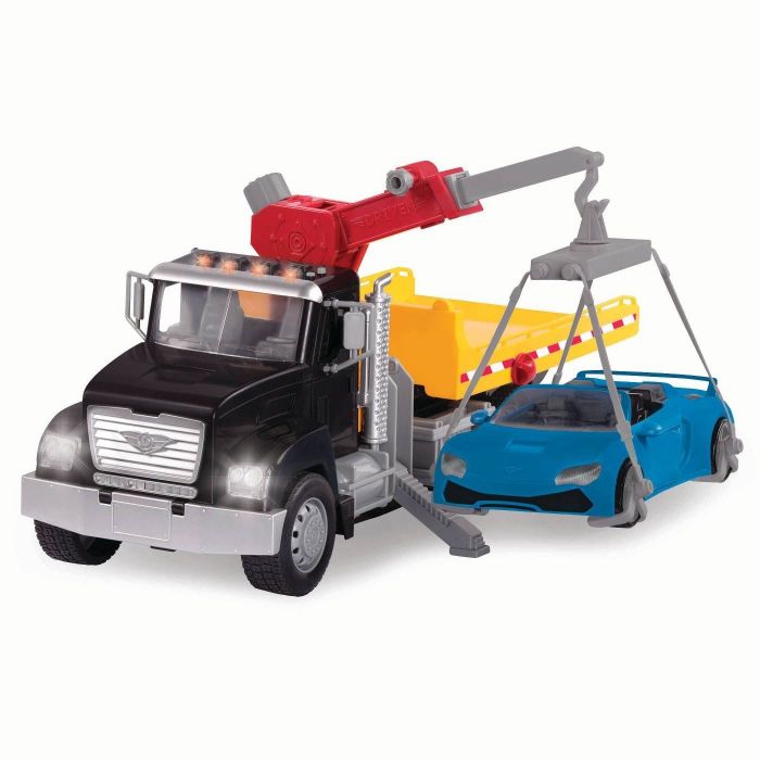 A crane truck lifting a blue car.