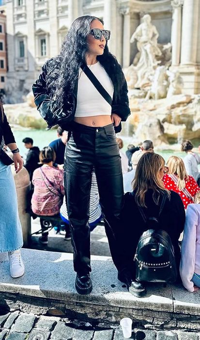 a reviewer showcasing the pants in black