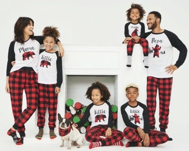 A family all decked out in coordinating pajamas.
