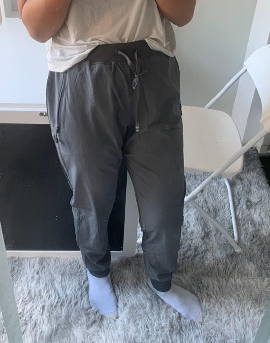 Reviewer wearing gray pants, displayed in the image