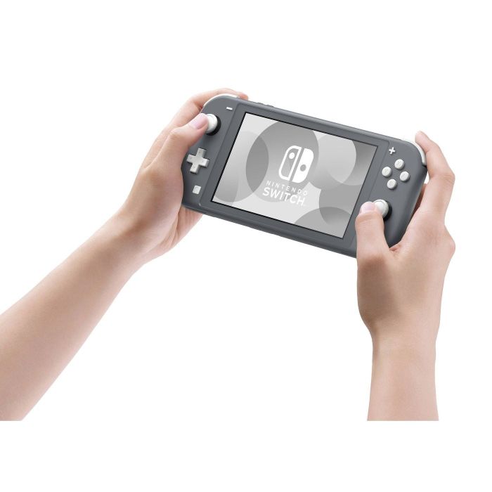 Hands holding the Nintendo Switch Lite console.