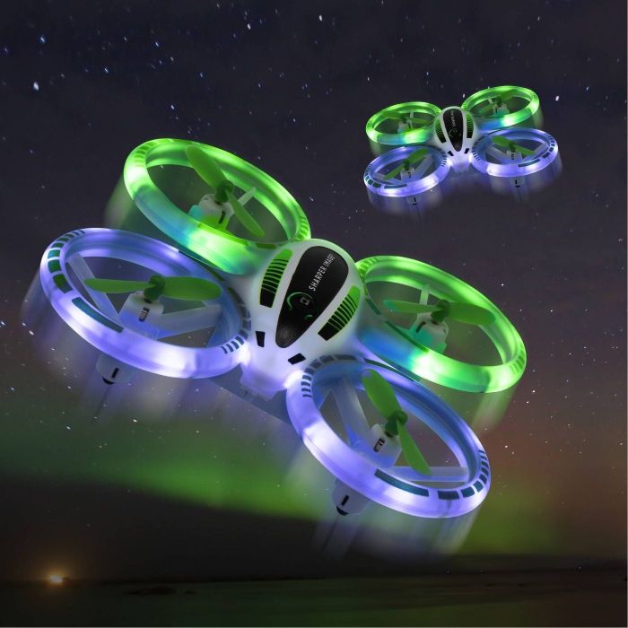 A light-up drone soaring through the night sky.