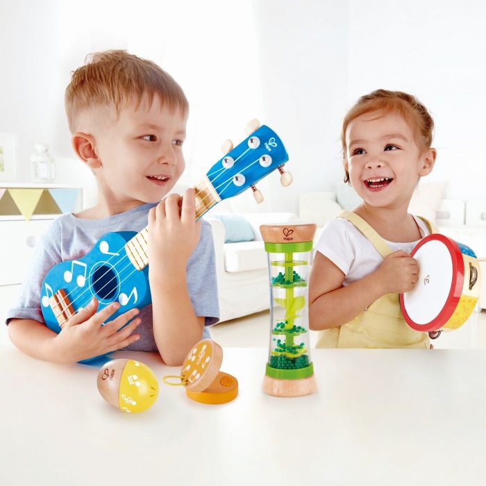 Two children enjoying their colorful musical instruments