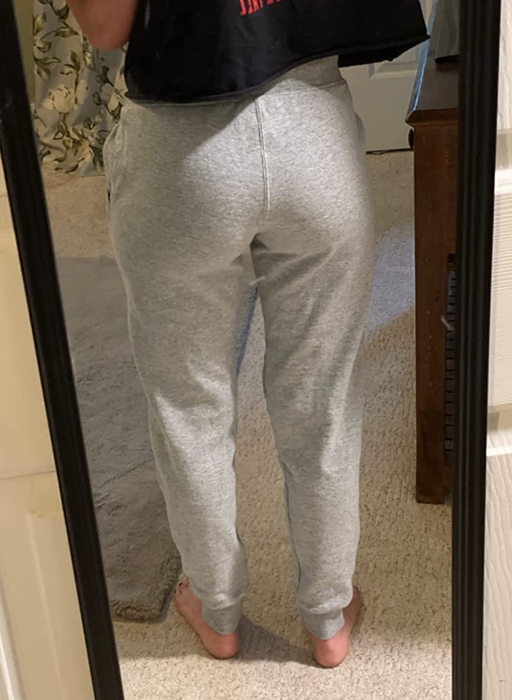 Image showing a reviewer in light gray pants