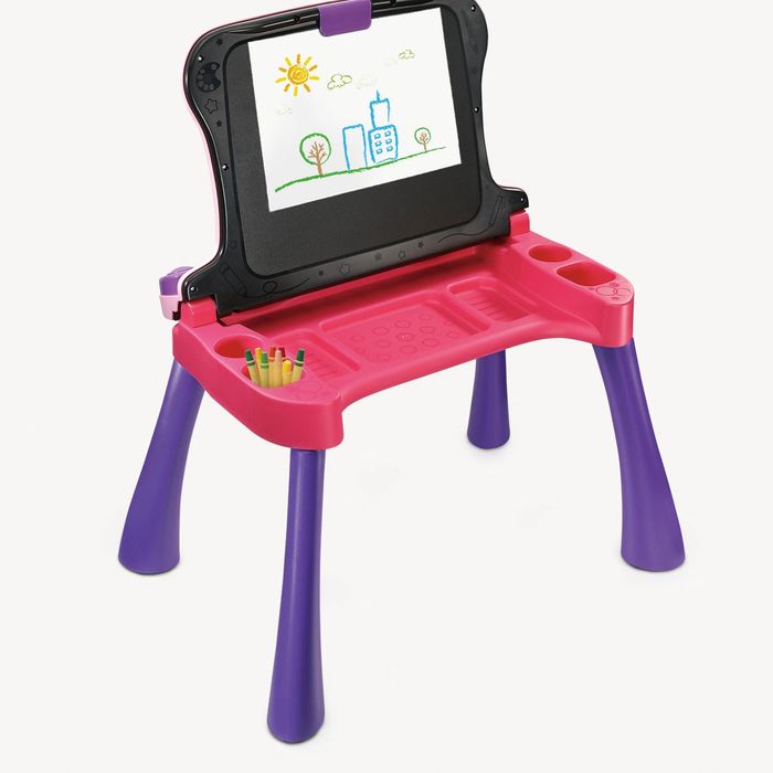 A pink and purple desk with the chalkboard folded up.