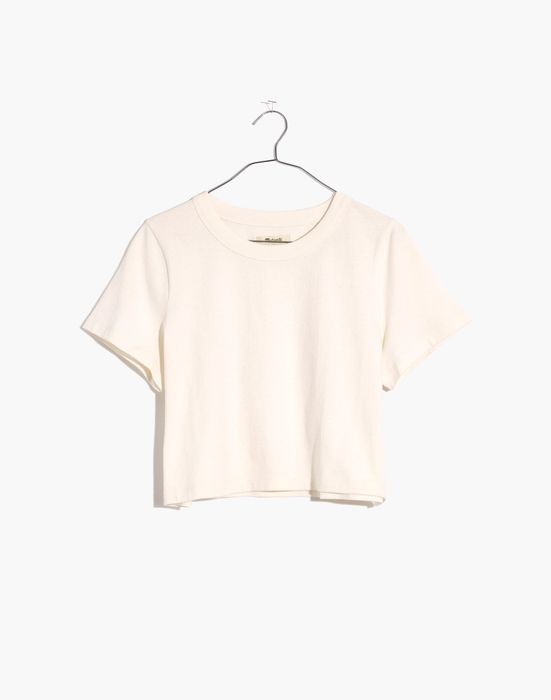 A product image of a shirt hanging on a hanger.
