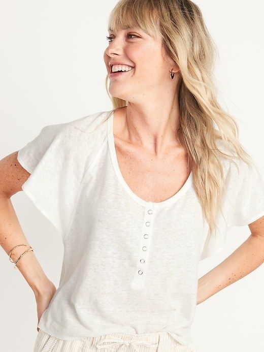 model wearing a white Henley crop top