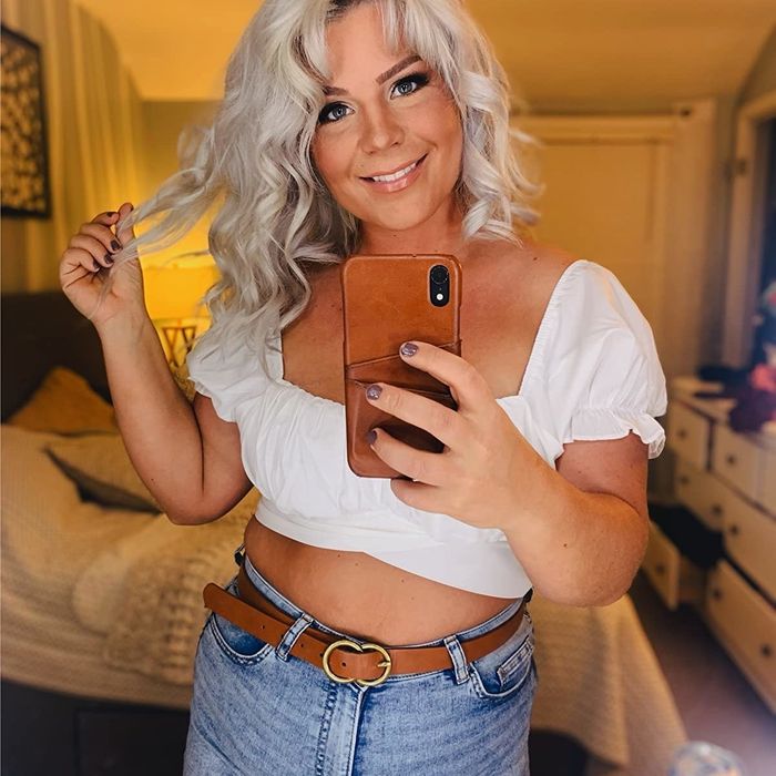 reviewer captures a mirror selfie wearing a crop top