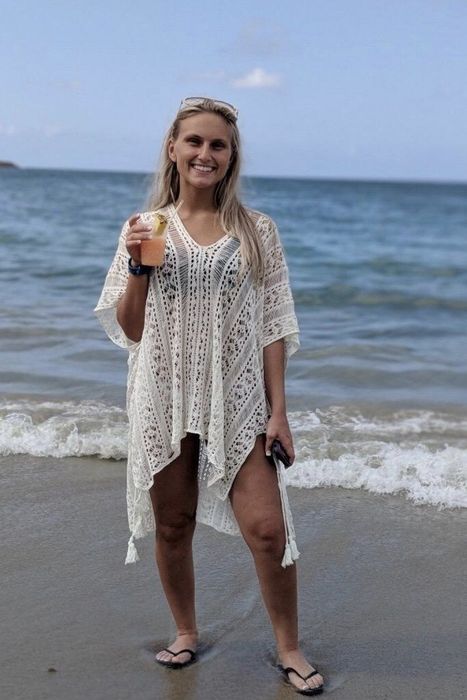 A reviewer wearing the white cover-up.