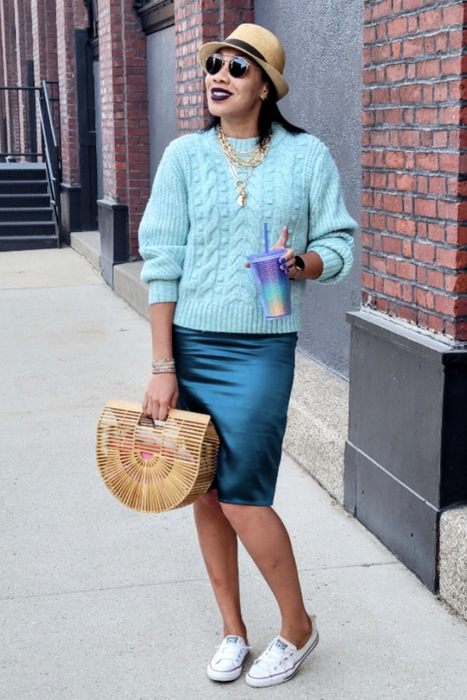 A customer review photo of them wearing the dress, styled with a cozy sweater and sneakers.