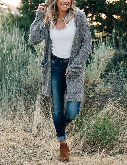 A model is seen wearing the open cardigan in gray.
