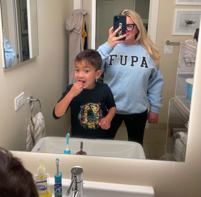 The author rocking the FUPA sweatshirt in a bold blue shade.