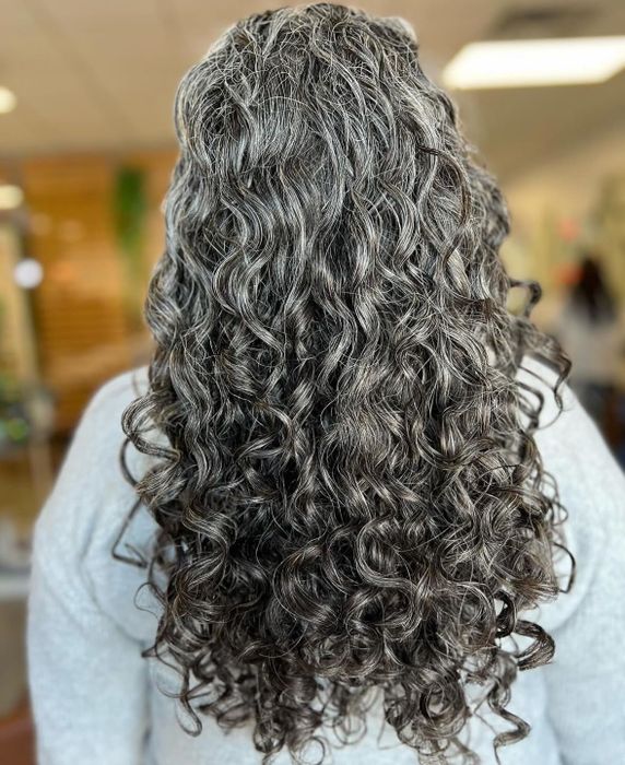 The reviewer’s hair after using the bonnet is shown.