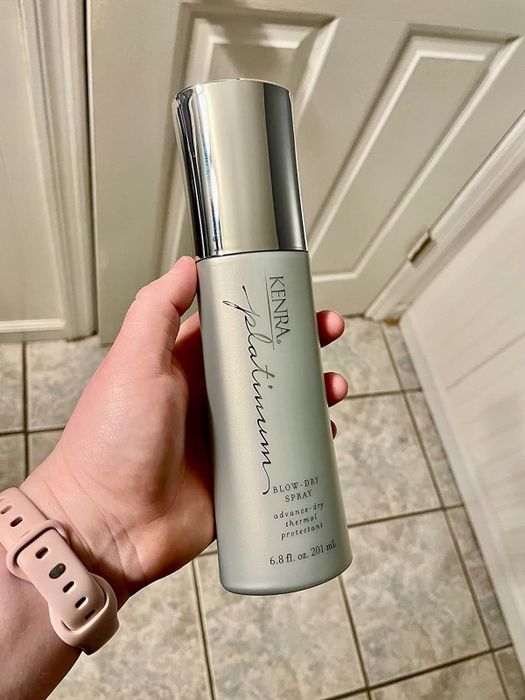 Here is the reviewer holding the spray.