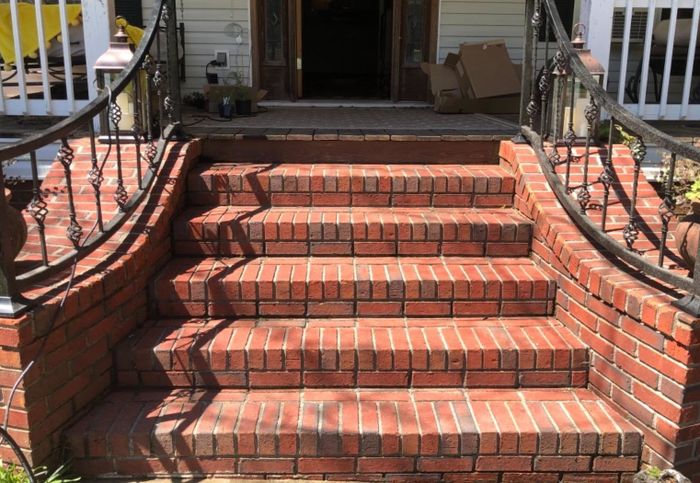 The same brick steps after cleaning, now looking fresh and spotless.