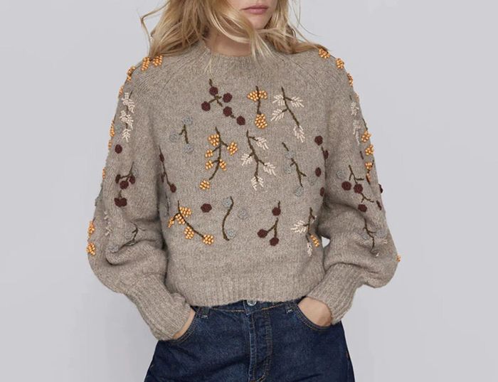A model showcasing the embroidered sweater.