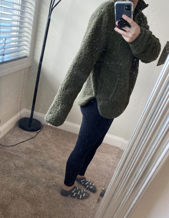 A customer photo showcasing the sweater's long arm length for an added touch of coziness.
