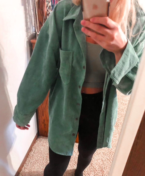 A customer review photo of them wearing the button-down in green.