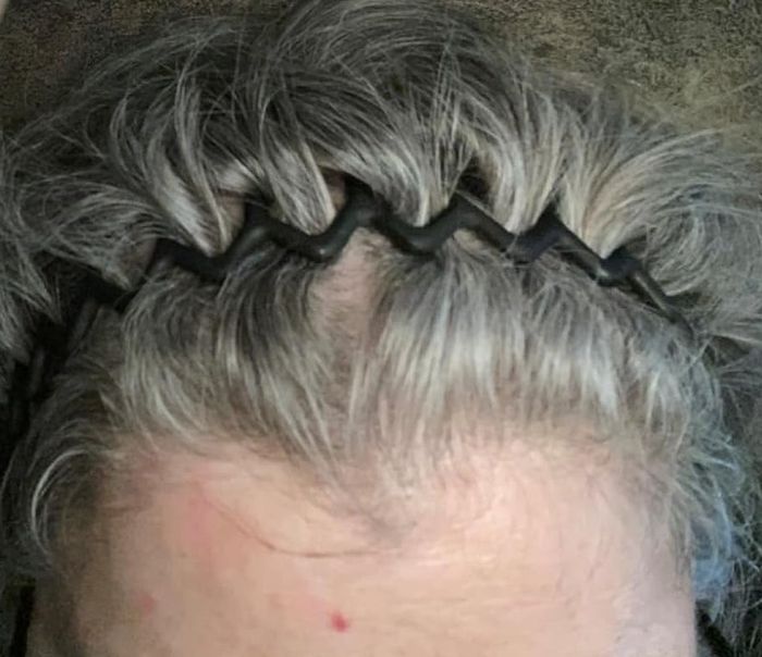 The reviewer showing off the black headband.