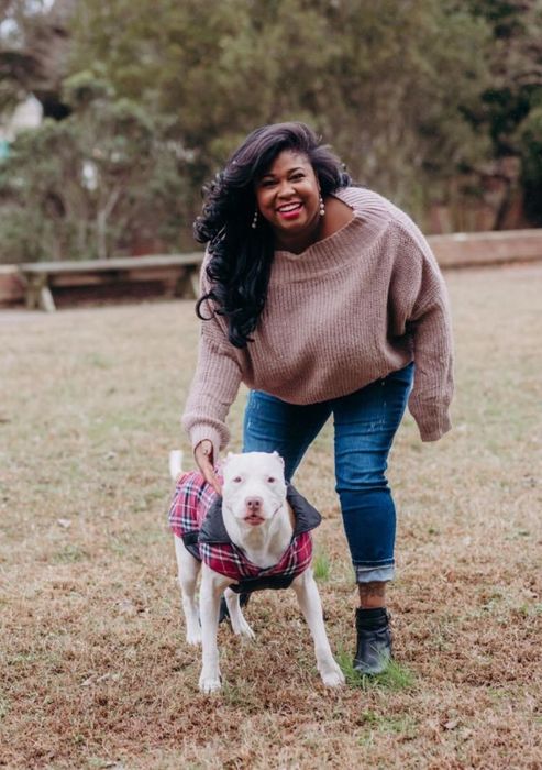 A customer review photo of them wearing the brown sweater with denim jeans.