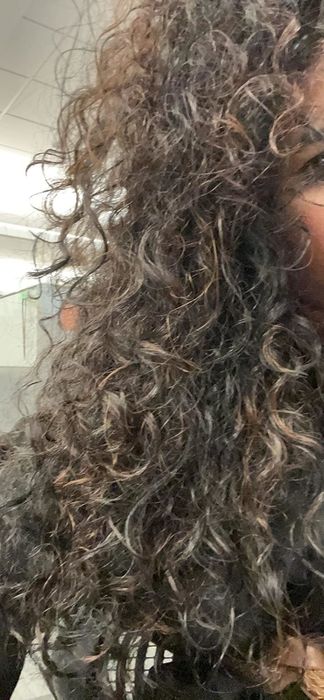 The reviewer’s hair after using the anti-humidity spray.