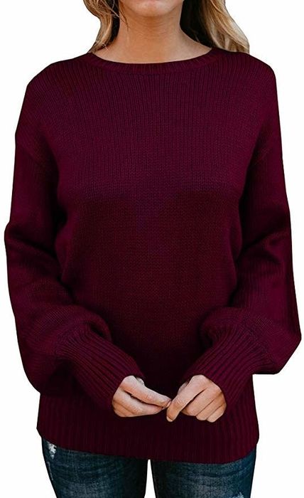 A model is pictured in the front view of the sweater in burgundy.