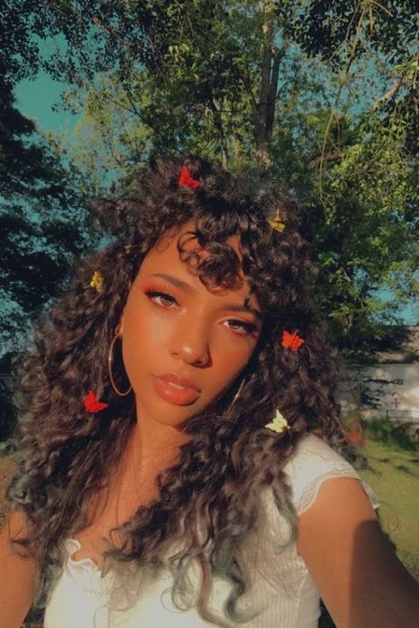 Reviewer photo of them with several mini butterfly clips adorning their hair