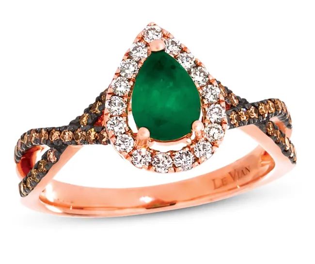 A pear-shaped emerald stone surrounded by small white diamonds, with a crisscross band embellished with chocolate diamonds.