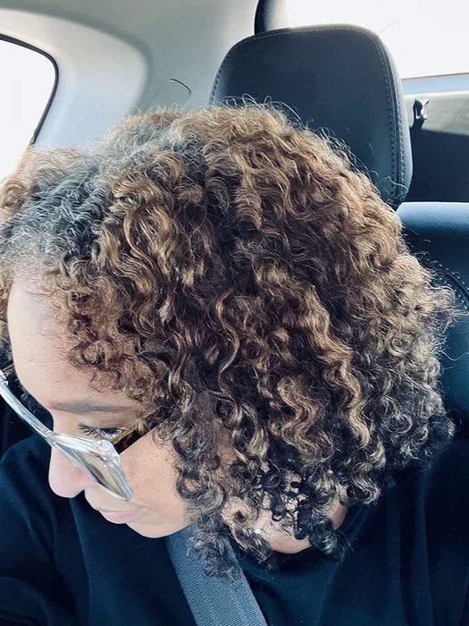 A detailed view showcasing the intricate curls of a reviewer