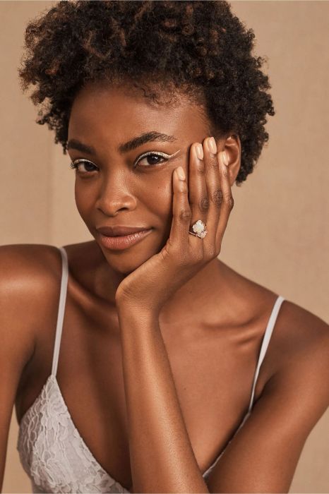A model showcasing the ring, elegantly worn on their ring finger, bringing attention to its remarkable design.