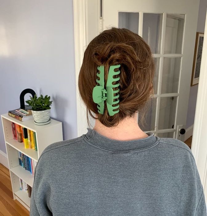 Reviewer photo featuring their hair styled with the green clip
