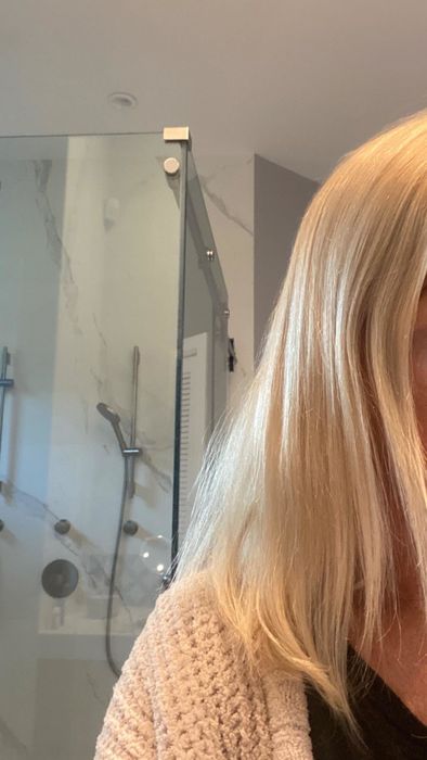 A photo shared by a reviewer displaying their hair's transformation after using the collagen treatment.