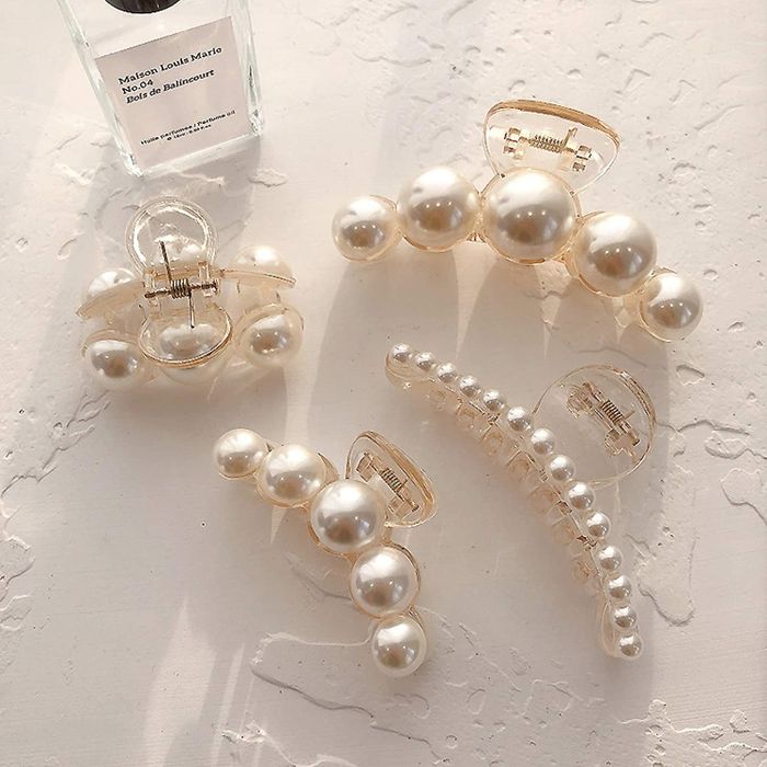 A set of four pearl claw clips in different sizes to suit every style.