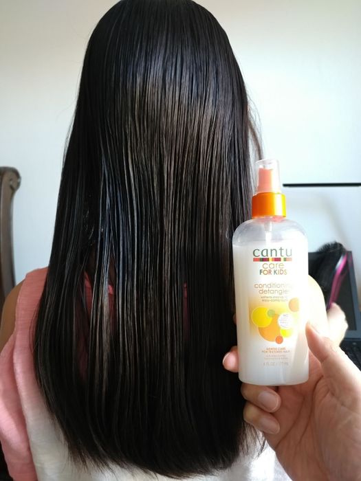 After photo from a reviewer showcasing sleek, tangle-free hair after applying the detangler spray.