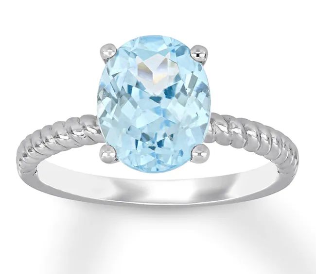 A silver rope band featuring an elegant oval aquamarine stone.