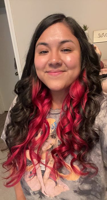 reviewer's hair styled in curls