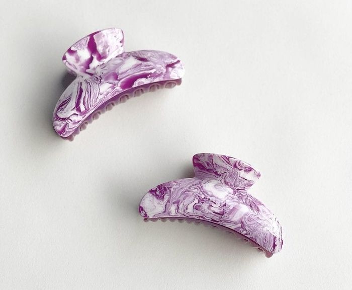 These stunning purple marbled claw clips are the perfect accessory to add a touch of elegance to your hair.