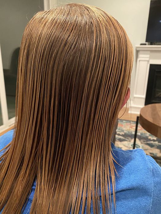 identical individual showcasing silky, knot-free hair