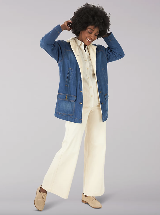 A model rocking the vintage, oversized Sherpa-lined denim jacket for a modern yet classic look.